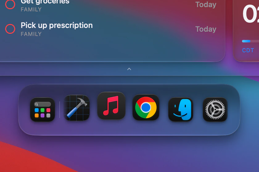 The recent apps dock under the bottom edge of the Island, dark appearance